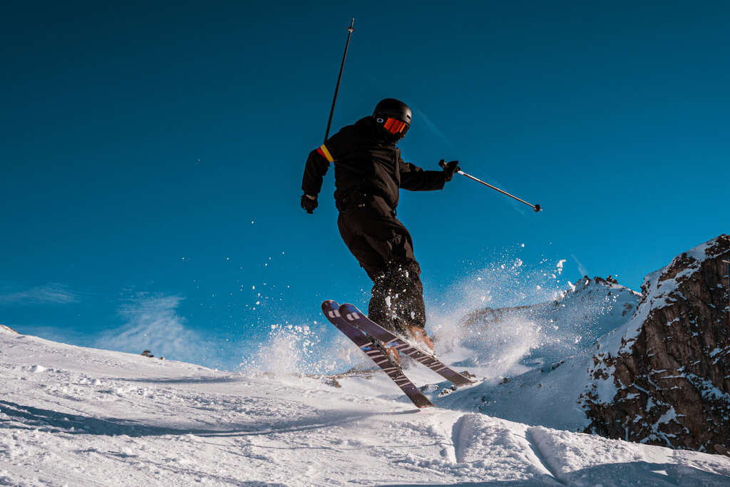 Skier jumping on skis in the Tignes ski area